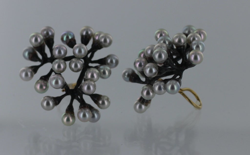 John Iversen 'Triple Jacks' Earrings. These handcrafted earrings are titled 'triple jacks' for their resemblance to the game of jacks and were designed in the 1990's.  Each earring is made of oxidized sterling silver with twenty four Akoya silver