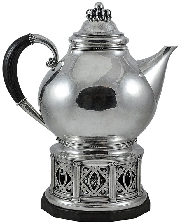 Georg Jensen sterling silver seven-piece Coffee/Tea Service No. 251 with ebony handles.  This Art Deco designed service was designed by Johan Rohde in 1917.  This seven-piece service consists of the following individual pieces:  Hot water kettle on