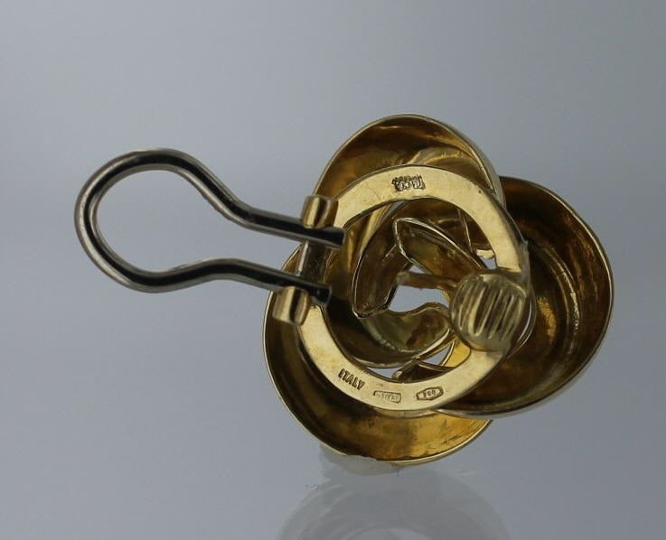 Tiffany & Company 18 kt gold earrings in a 'knot' design.  The earrings measure 3/4