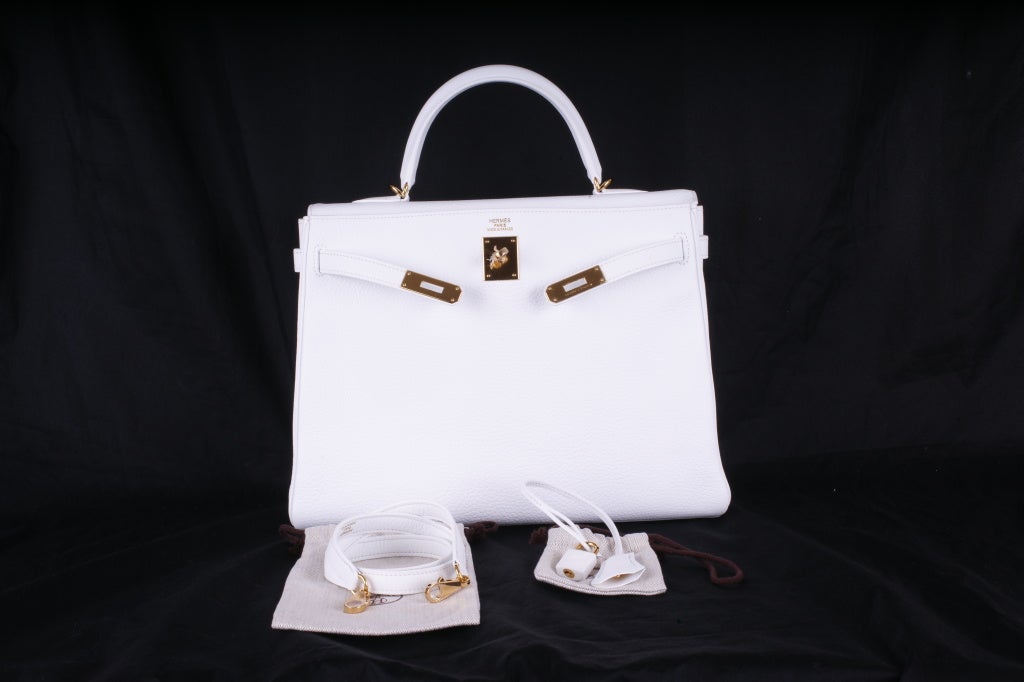 Hermes Kelly 35cm White Togo with Gold Hardware. Stunning and bold white with gold that will make a statement. Perfect for any season and offered exclusively to 1stdibs connoisseurs.