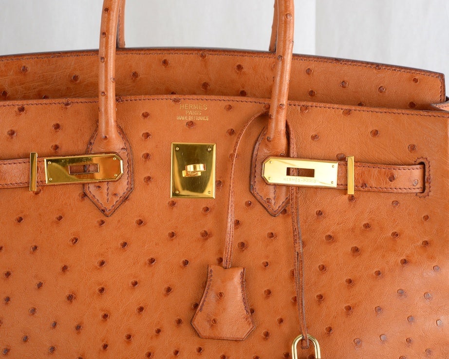 CLASSIC CHIC HERMES BIRKIN BAG 35CM OSTRICH COGNAC GOLD IMPOSSIBLE TO GET!

AS ALWAYS ANOTHER ONE OF MY FAB FINDS!
HERMES BIRKIN 35CM IMPOSSIBLE TO GET DISCONTINUED OSTRICH LEATHER IN GORGEOUS GOLD COGNAC WITH CHEVRE LEATHER INTERIOR AND GOLD