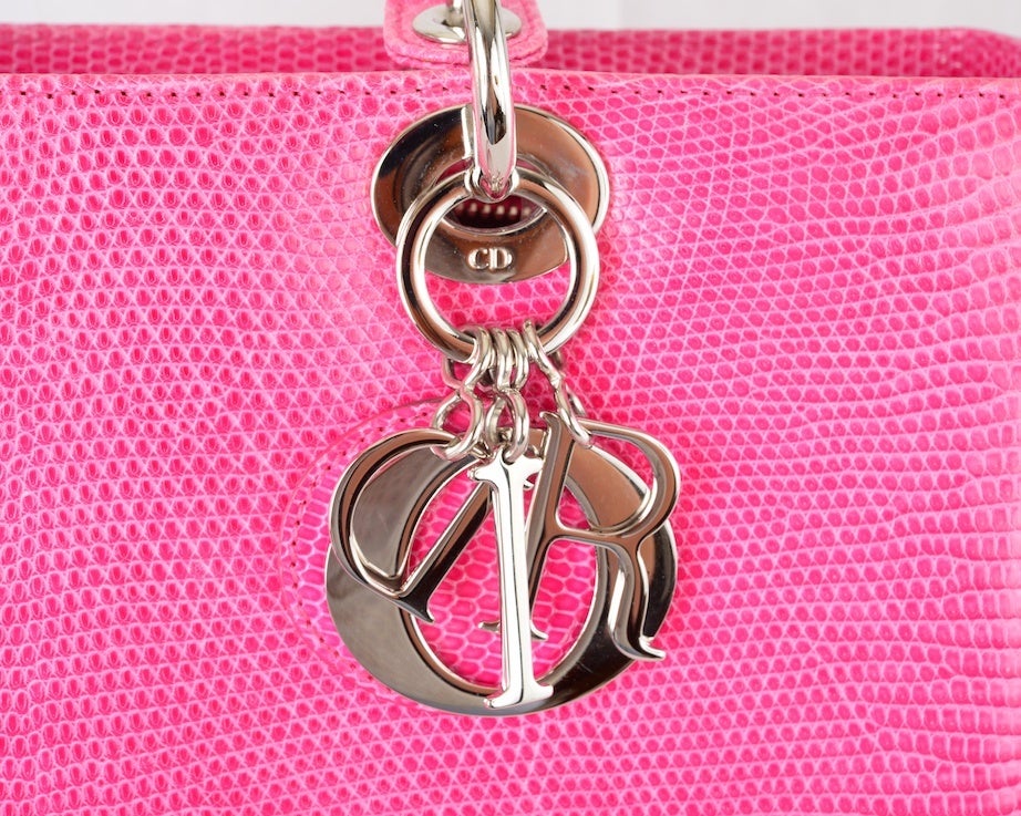 THAT FAMOUS CHRISTIAN DIOR LADY DIOR PINK LIZARD BAG

CHRISTIAN DIOR STUNNING CLASSIC LADY DIOR PINK LIZARD TOTE BAG WITH PALLADIUM CHARMS. IN THE MOST BEAUTIFUL PINK! SOLD OUT EVERYWHERE.

THE ULTIMATE BAG TO OWN! MAKE A STATEMENT WITHOUT