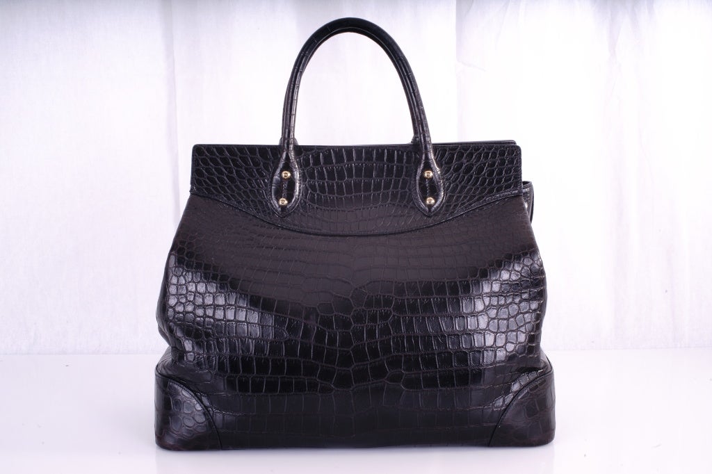 Ralph Lauren Crocodile Bag, Black with Gold Hardware.

Crafted from exquisite hand-selected African crocodile and finished with custom Italian hardware. This is a gorgeous bag and a great croc buy... The bag is pre-loved but in excellent overall