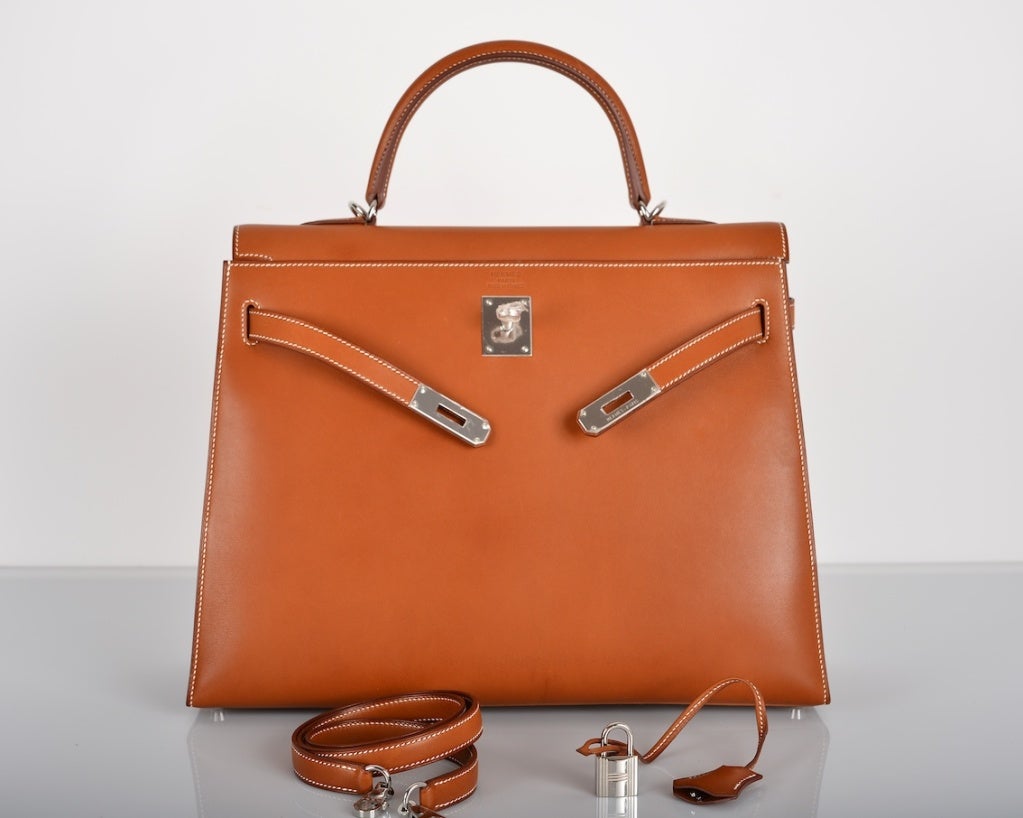 A JF FAVE! HERMES KELLY BAG 35CM BARENIA PALLADIUM HARDWARE MUST GET! 

As always, another one of my fab finds, IMPOSSIBLE BARENIA Hermes 35cm KELLY BARENIA  gorgeous FAUVE with PALLADIUM hardware and contrast white stitching.
✸ SOMETHING