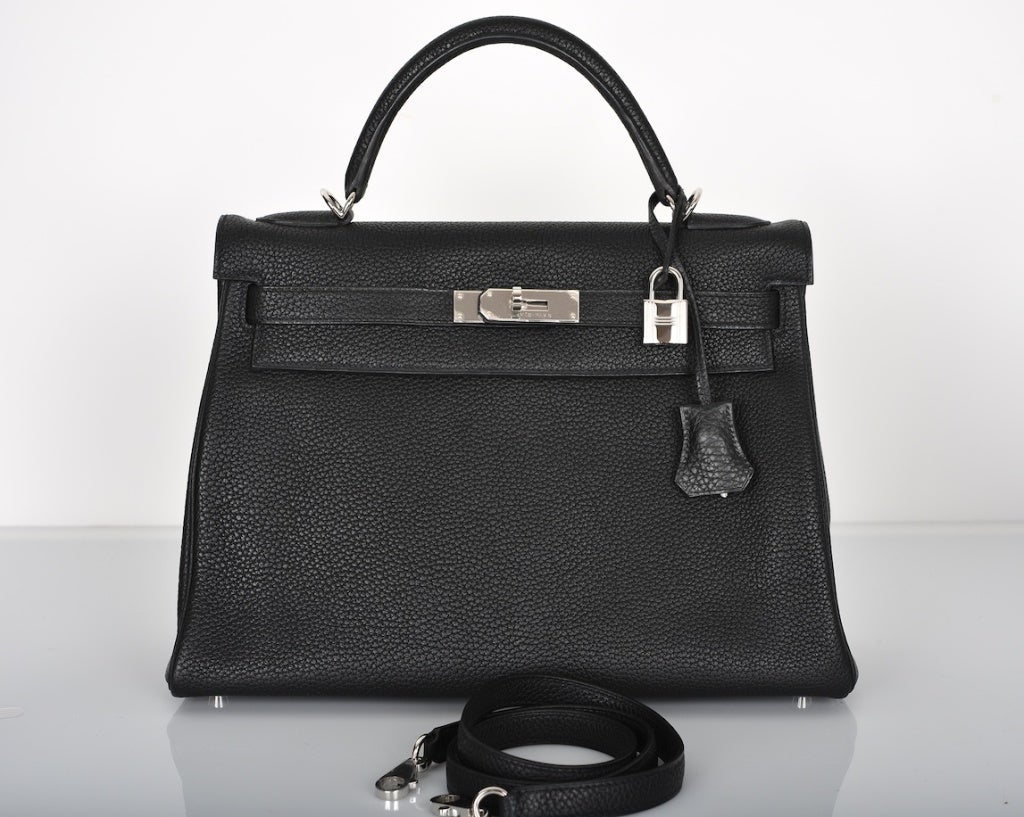 FOREVER CLASSIC HERMES KELLY BAG 32cm BLACK TOGO PALLADIUM HARDWARE

As always, another one of my fab finds,  Hermes 32cm PERFECT BLACK KELLY IN TOGO LEATHER & Palladium hardware

This bag is brand new with original box and accessories.
THERE