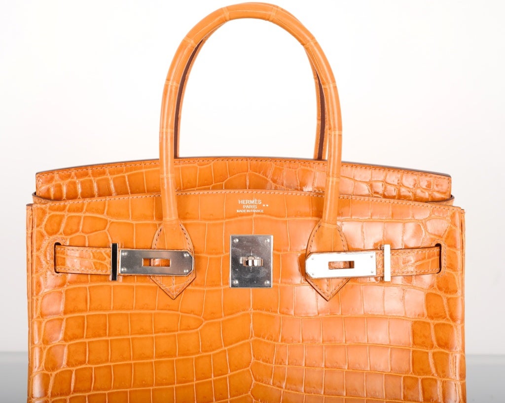 As Always Another One Of My Fab Finds Hermes The Un-Gettable Saffron Crocodile Birkin Bag Nilo With Palladium Hardware.

- The Most Amazing  Crocodile Color With Palladium Hardware Sexiest Bag Ever!!!!!
- Plastic Is Still On The Hardware Bnib
-