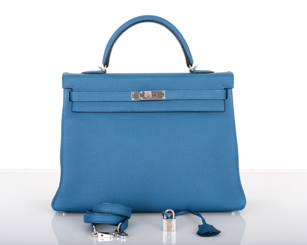AS ALWAYS, ANOTHER ONE OF MY FAB FINDS, HERMES 35CM INCREDIBLE NEW COLOR !! BLEU DE GALICE KELLY WITH PALLADIUM HARDWARE! THIS COLOR WILL TAKE YOUR BREATH AWAY TRULY A MASTER PIECE!

THIS BAG COMES WITH LOCK, KEYS, CLOCHETTE, A SLEEPER FOR THE