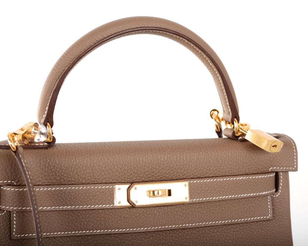 As Always, Another One Of My Fab Finds, The Hermes 28Cm Kelly In Beautiful Togo Leather In The Most Beautiful Etoupe Color With Contrast White Stitching And Impossible Gold Hardware!

This Bag Comes With Lock, Keys, Shoulder Strap Clochette, A