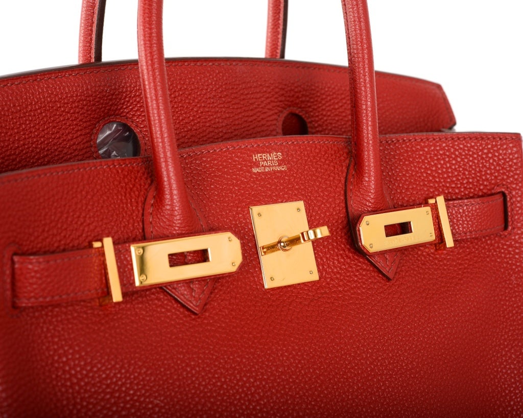 AS ALWAYS..PERFECTION! HERMES 30CM BIRKIN BAG IN THE MOST BEAUTIFUL ROUGE GARANCE  & GOLD COMBINATION. TOGO LEATHER. THE GOLD HARDWARE LOOKS AMAZING WITH THIS RED! 

THE BAG IS MINT INSIDE & OUT, COMES WITH A SLEEPER AND ALL THE ACCESSORIES.