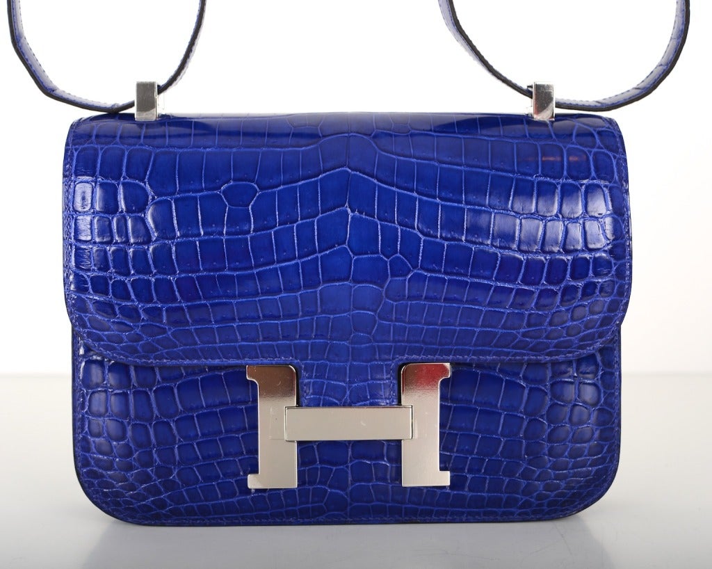 AS ALWAYS, ANOTHER ONE OF MY FAB FINDS, HERMES CONSTANCE IN A PERFECT SUPER RARE SIZE 23CM!!! INCREDIBLE BLUE ELECTRIC NILO CROCODILE WITH PALLADIUM HARDWARE. ACTUALLY BIG ENOUGH FOR EVERYDAY USE. COMFY DOUBLE STRAP THAT IS PERFECT TO CARRY CROSS