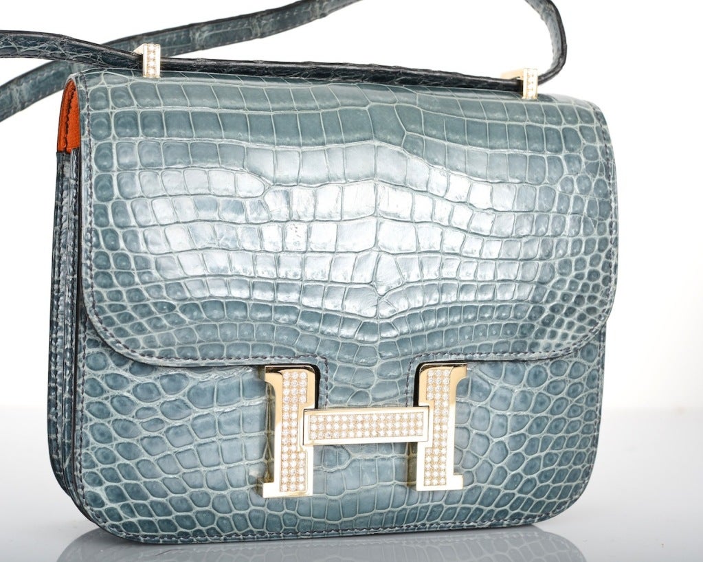 HERMES EXTRAORDINARY COLLECTION 18CM DIAMOND BLUE JEAN POROSUS CROCODILE DOUBLE-GUSSET CONSTANCE BAG WITH 18K WHITE GOLD HARDWARE 

RETAIL ON THIS BAG NEW IS $146,000 AVAILABLE FOR $95,000
EXCELLENT CONDITION

THIS IS QUITE SIMPLY AN