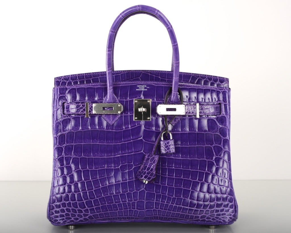 AS ALWAYS, ANOTHER ONE OF MY FAB FINDS, HERMES 3OCM BIRKIN IN BEAUTIFUL NEW COLOR CROCODILE ULTRA VIOLET! ONE OF THE MOST GORGEOUS COLORS HERMES HAS EVER CREATED!! THE COLOR IS RICH AND SUPER BRIGHT. IT TAKES ON A DIFFERENT SHADE DEPENDS ON WHAT YOU