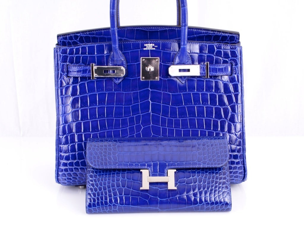 HERMES CROCODILE CONSTANCE LONG WALLET CLUTCH POCHETTE BLUE ELECTRIC

As always, another one of my fab finds, Hermes CONSTANCE LONG WALLET IN THE MOST FABULOUS BLUE ELECTRIC alligator with palladium hardware.
MEASURES: 8