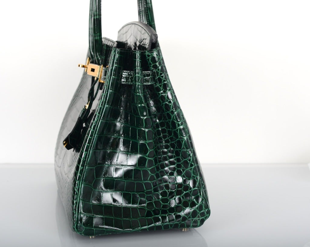 THIS IS A VERY SPECIAL COLOR AND COMBINATION.
THIS BAG IS ABSOLUTELY BRAND NEW TAKEN OUT OF THE BOX ONLY FOR PHOTO SHOOT.

HERMES BIRKIN 35CM IN THE MOST MAGICAL GREEN VERT FONCE  POROSUS CROC WITH GOLD HARDWARE.

THIS COLOR IS A DEEP FOREST