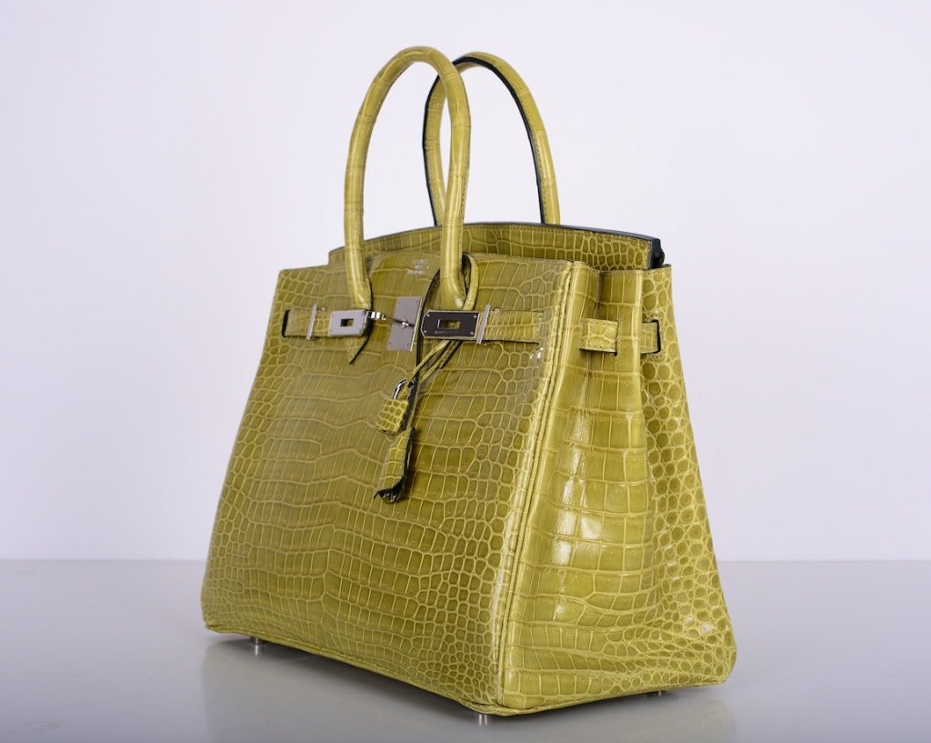 AS ALWAYS... PERFECTION! HERMES 35CM BIRKIN BAG IN THE MOST BEAUTIFUL POROSUS CROCODILE! THE COLOR IS VERT ANIS WITH PALLADIUM HARDWARE. STUNNING RICH BRIGHT CANDY COLOR GREEN.

ABSOLUTELY MINT! THE PLASTIC IS ON THE SPINDLE! THE HANDLES HAVE NO