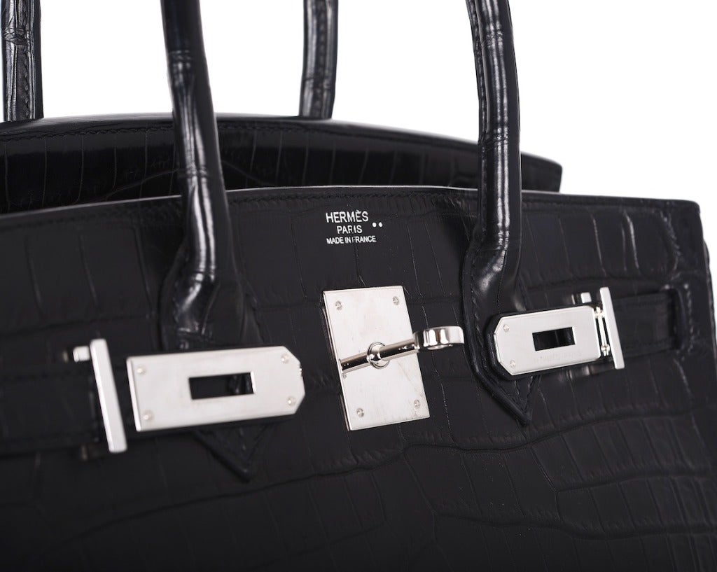 THIS IS A VERY SPECIAL BAG! HERMES BIRKIN 25CM IN THE BEAUTIFUL MATTE BALCK NILO CROCODILE & CHEVRE INTERIOR.
THE HARDWARE IS PALLADIUM.

THIS BAG IS BRAND NEW! COMES WITH CITES AND ALL THE ACCESSORIES. INCREDIBLE CROCODILE! THE SCALES ARE TRULY