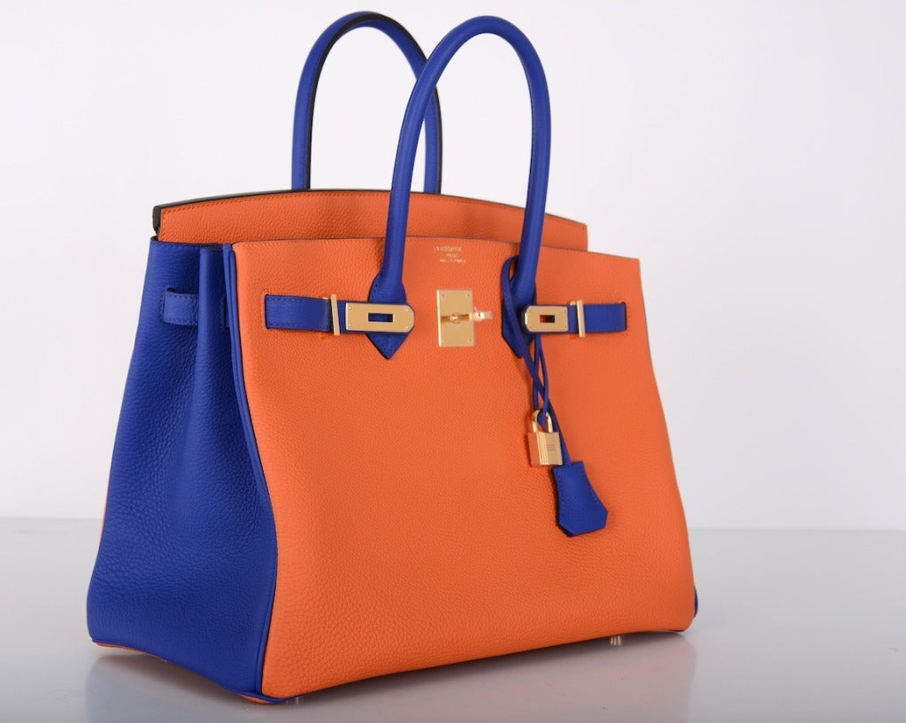 As always, another one of my fab finds! Hermes 35cm Birkin
 Bag.

Orange & electric blue HSS bi-color with gold hardware. This bag is stamped with a horseshoe, meaning it was a special order.

The pictures are very accurate! The colors in the