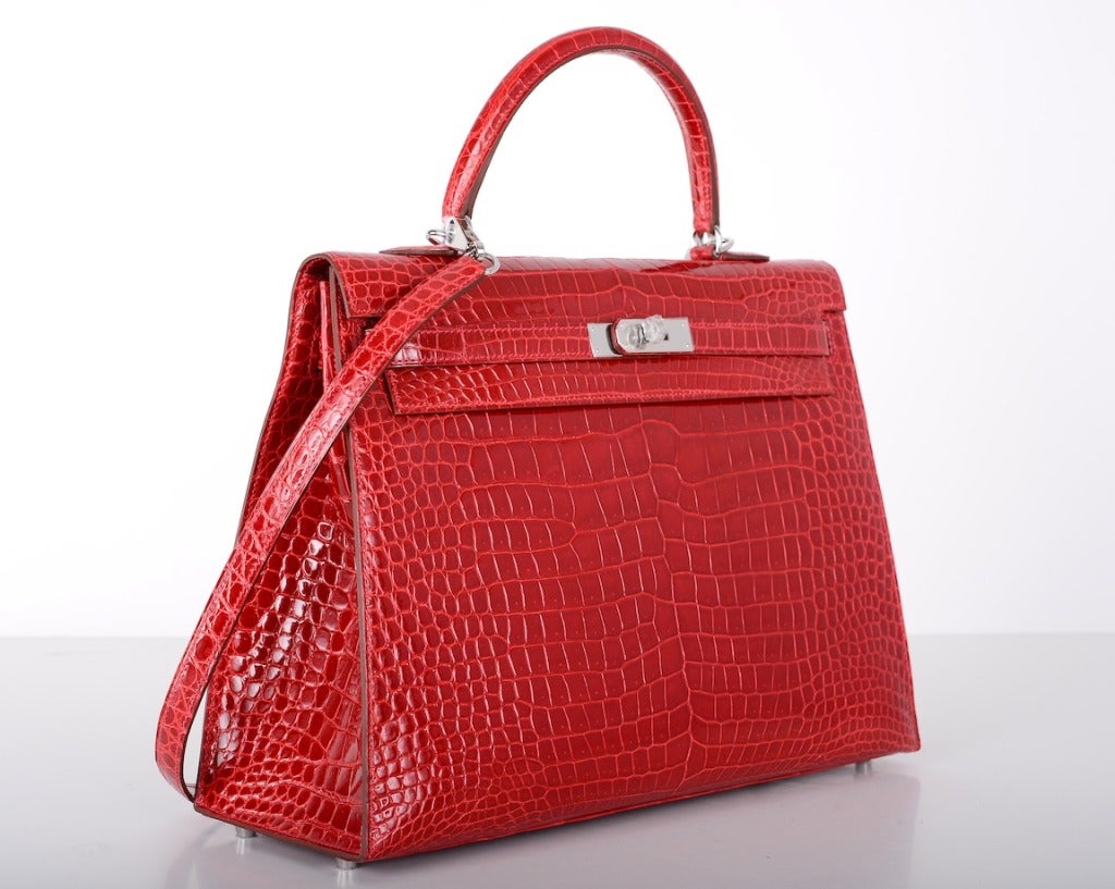 As always, another one of my fab finds! The Hermes 35cm KELLY in beautiful color Hot red braise. One of the most gorgeous colors Hermes has ever created. It takes on a different shade! It depends on what you wear it with. Magical, to say the