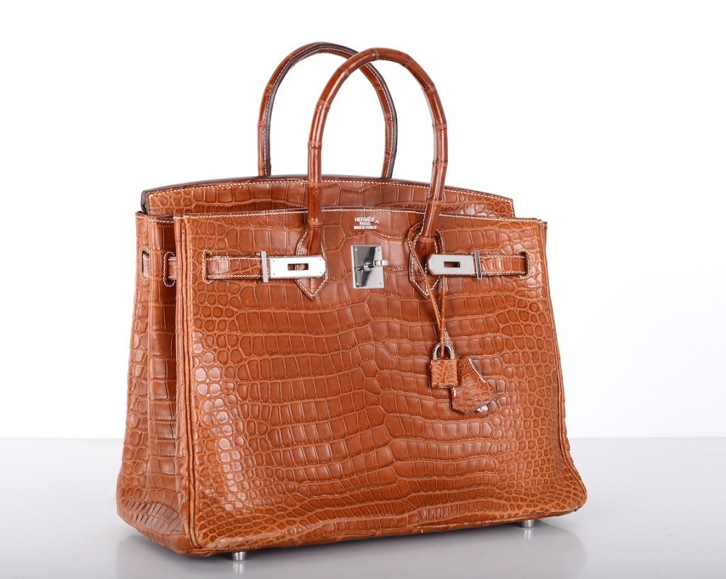 THIS IS A VERY SPECIAL BAG - HERMES BIRKIN BAG 35CM IN THE MOST BEAUTIFUL MATTE FAUVE POROSUS CROCODILE & CHEVRE INTERIOR.
THE HARDWARE IS PALLADIUM, MINT CONDITION! PLEASE VIEW ALL PICTURES AND EMAIL WITH ANY QUESTIONS!

THIS BAG IS pre-loved