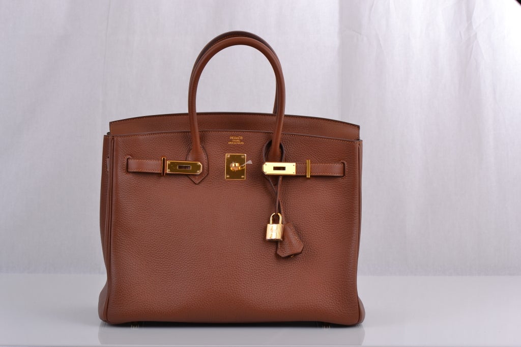 Hermes Birkin 35cm Marron D'inde With Gold Hardware. This is a new color that is absolutely a stunning combination, deeper than the classic gold and very rich in appearance. The gold hardware makes the color combination irresistible and timeless
