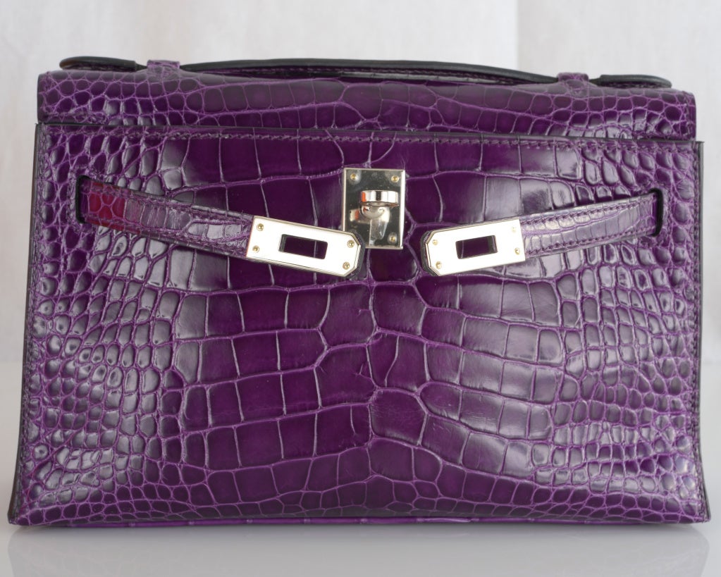 HERMES KELLY BAG JPG POCHETTE AMETHYST ALLIGATOR CLUTCH

As always, another one of my fab finds, Hermes Kelly Jpg pouchette in stunning semi matte ALLIGATOR. The color is breathtaking impossible to get amethyst. The hardware is palladium. Perfect
