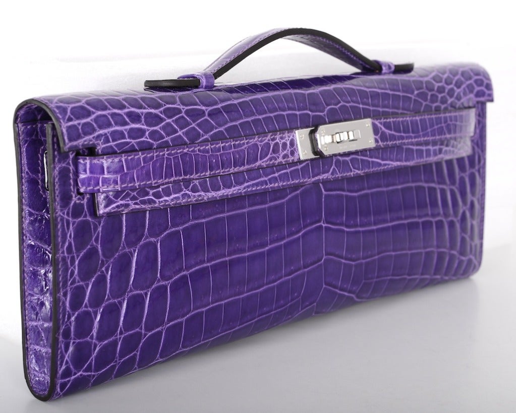 As always, another one of my fab finds! CANT GET THIS! Hermes KELLY CUT IN THE MOST AMAZING ULTRA VIOLET CROCODILE NILO CROCODILE with PALLADIUM hardware.
MEASURES:
12 1/4 x 5