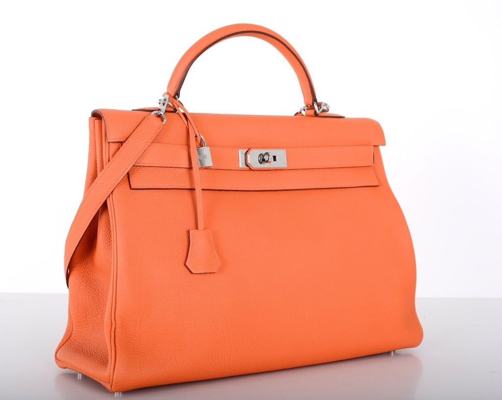 As always, another one of my fab finds! Hermes 40cm PERFECT ORANGE KELLY IN TOGO LEATHER & palladium hardware!
BAGINIZER IN SZ 30 IS PERFECT FOR THE 40CM KELLY! 
This bag is brand new stamp O. Plastic is off. The bag is new with original box and