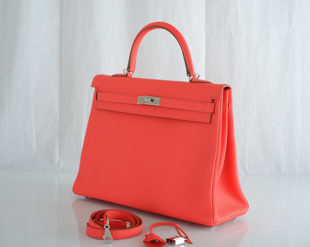HERMES KELLY BAG 35CM ROSE JAIPUR PALLADIUM HARDWARE MUST GET

As always, another one of my fab finds, INTRODUCING Hermes 35cm KELLY for Summer 2012 NEW ROSE JAIPUR gorgeous bright NEON PINK with PALLADIUM hardware CLEMENCE leather. OUR CAMERA
