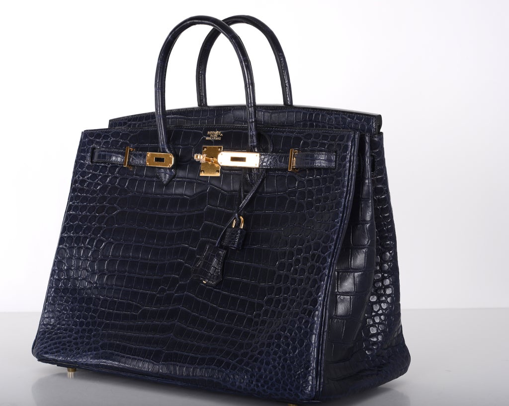 Hermes 40cm Birkin in beautiful MATTE POROSUS Blue indigo. One of the most beautiful blue colors Hermes has ever created. It's a dark midnight blue. The gold hardware makes it pop! Magical, to say the least!

Porosus crocodile with stunning gold