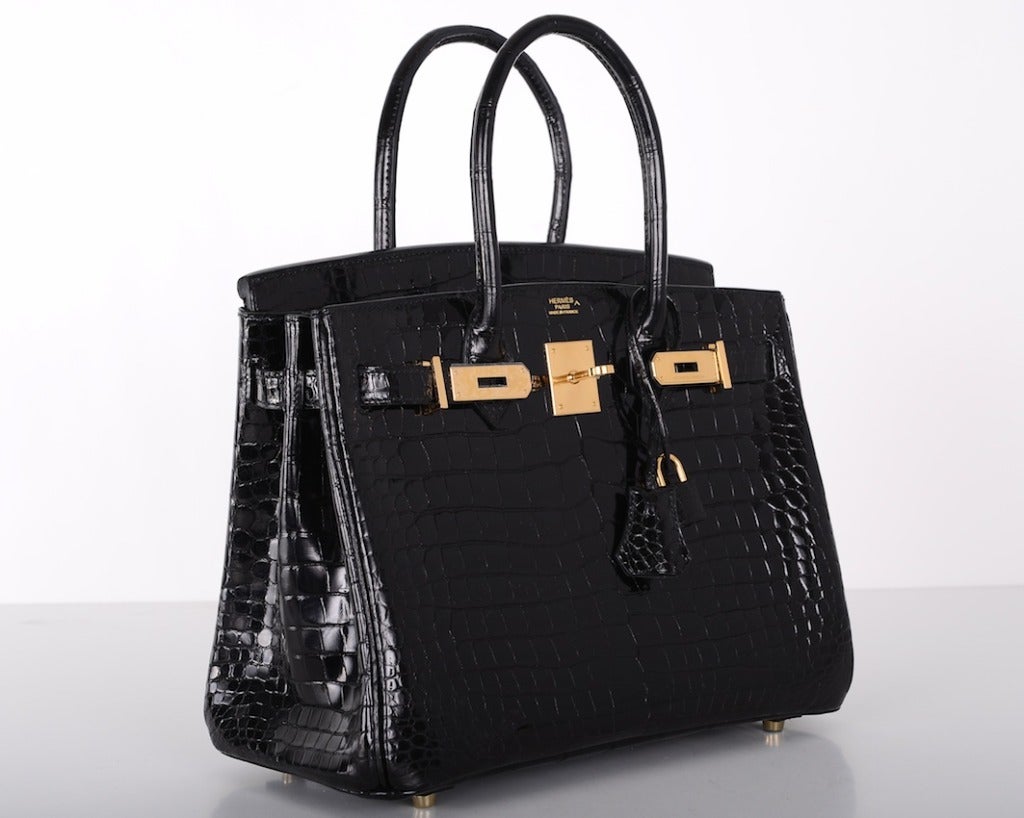 EXCLUSIVE offer for this porosus crocodile 30cm with gold hardware!

HERMES BIRKIN BAG BLACK WITH GOLD HARDWARE IN ABSOLUTE PRISTINE CONDITION! COMES WITH A BOX AND ALL THE ACCESSORIES. THE BAG IS STAMPED L! IMMACULATE AND SO RARE TO FIND IN