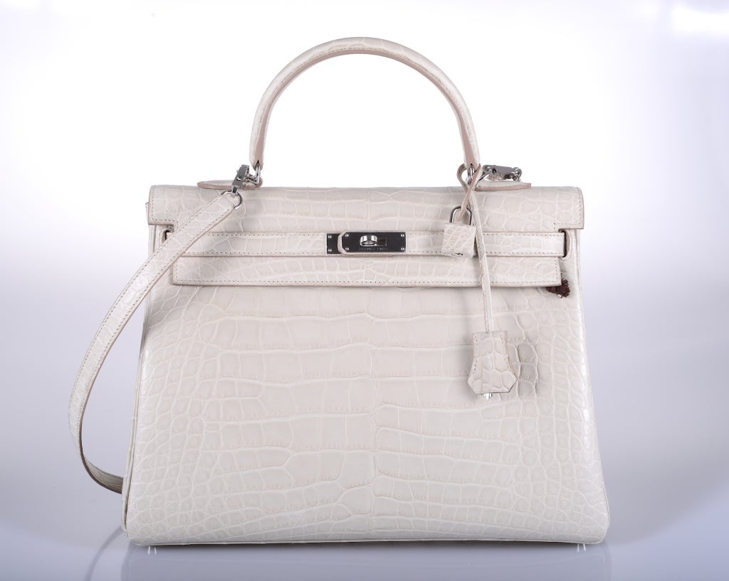 As always, another one of my fab finds! The sexiest bag ever… Hermes 35cm KELLY in beautiful BETON MATTE ALLIGATOR WITH BEAUTIFUL palladium HARDWARE! THIS BAG WILL TAKE YOUR BREATH AWAY!

This bag comes with lock, keys, clochette, a sleeper for