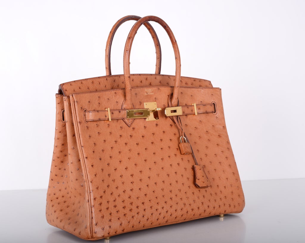 As always, another one of my fab finds!
HERMES BIRKIN 35CM IMPOSSIBLE TO GET DISCONTINUED OSTRICH LEATHER IN GORGEOUS GOLD COGNAC WITH CHEVRE LEATHER INTERIOR AND GOLD HARDWARE!

THIS BAG IS PRE-LOVED IN GREAT CONDITION! ABSOLUTELY IMMACULATE! IF