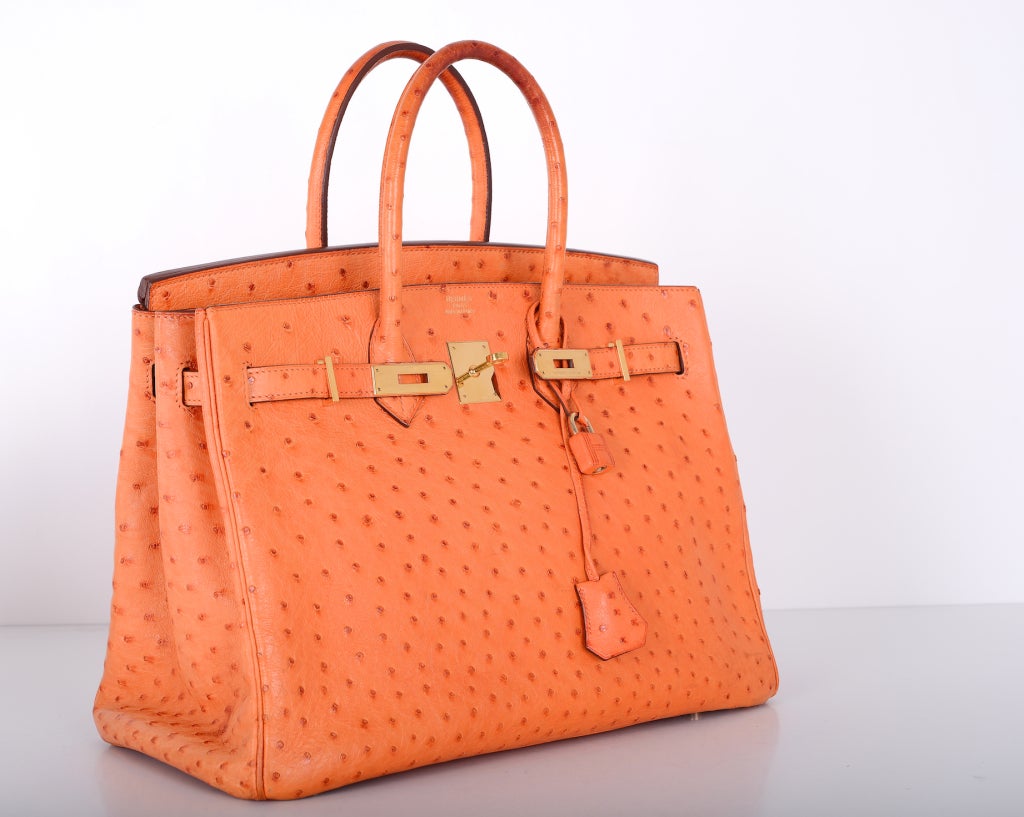 AS ALWAYS, ANOTHER ONE OF MY FAB FINDS!
HERMES BIRKIN 35CM! IMPOSSIBLE TO GET! DISCONTINUED OSTRICH LEATHER IN GORGEOUS ORANGE WITH CHEVRE LEATHER INTERIOR AND GOLD HARDWARE!

THIS BAG IS PRE-LOVED. PLEASE LOOK AT ALL THE PICTURES. THERE ARE A