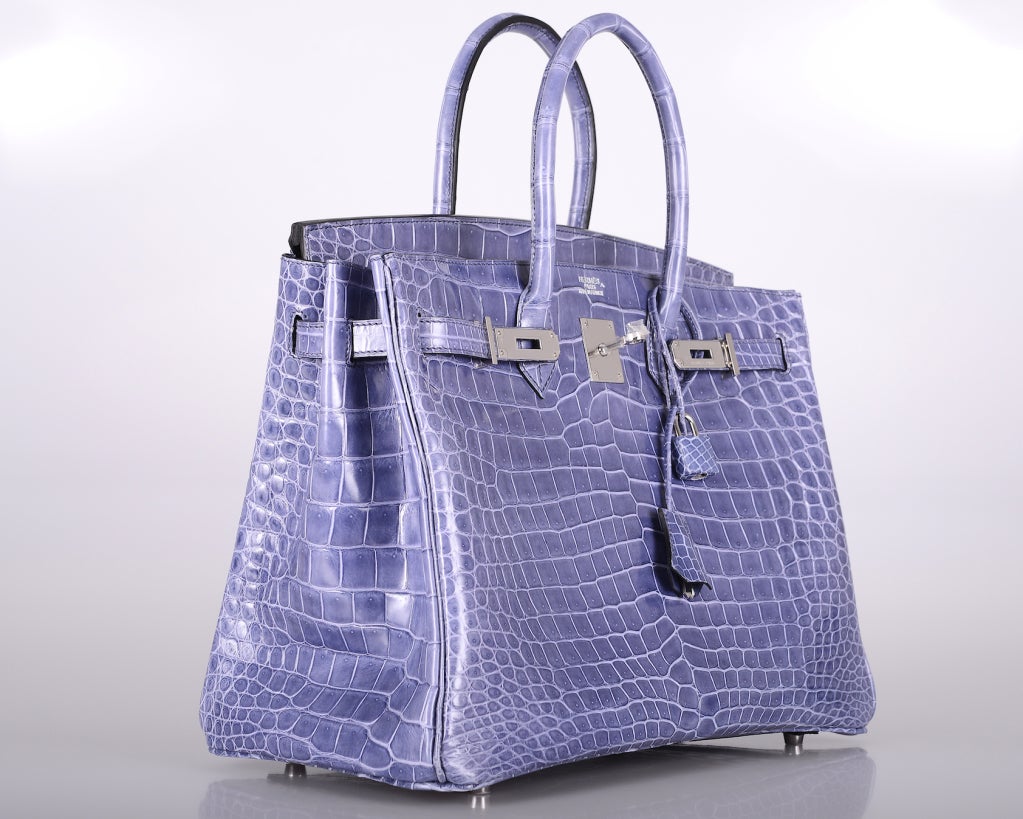 HERMES BIRKIN 35cm IN THE MOST MAGICAL BLUE BRIGHTON SEMI-SHINY POROSUS CROC WITH PALLADIUM HARDWARE.
 
THIS COLOR IS NO LONGER AVAILABLE TO ORDER. THIS WAS A SPECIAL ORDER THAT TOOK 3 YEARS TO COME IN.

THIS COLOR IS MORE LAVENDER THAN BLUE. IT