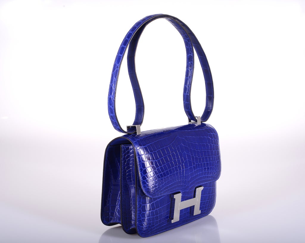 As always, another one of my fab finds! Hermes Constance in a PERFECT SUPER RARE size 23cm! Incredible blue electric nilo crocodile with palladium hardware. Actually big enough for everyday use. Comfy double strap that is perfect to carry cross body