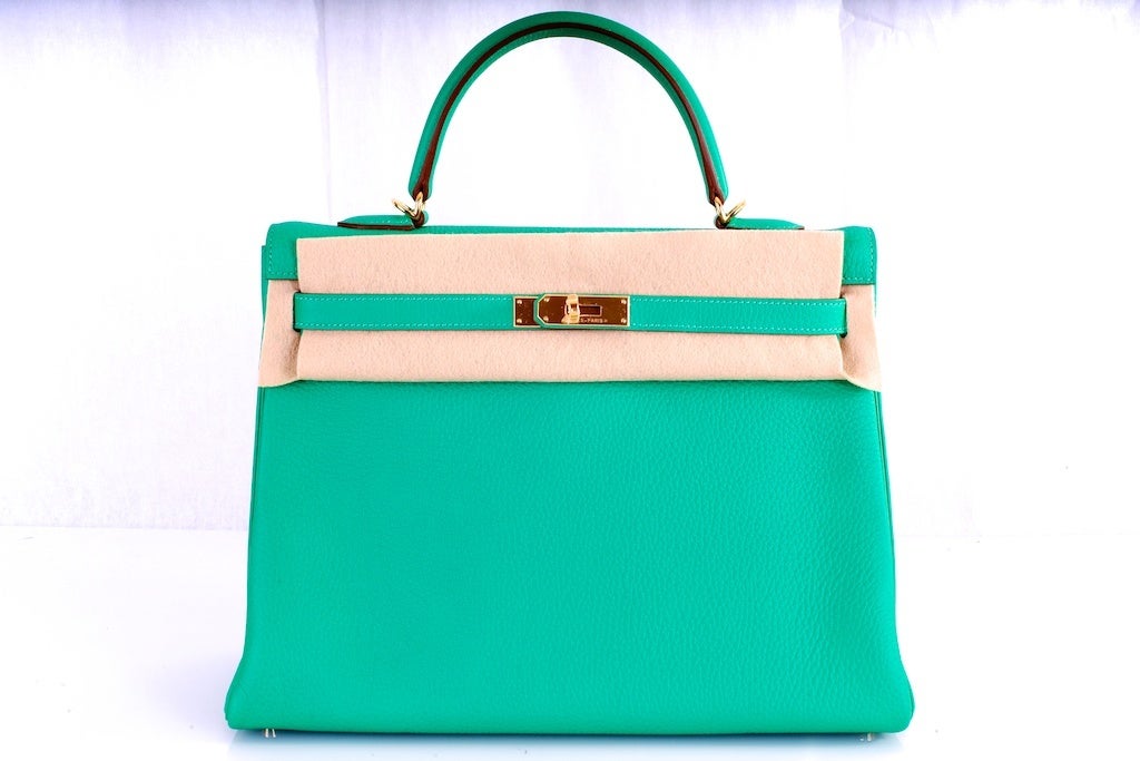 NEW COLOR HERMES KELLY BAG 35CM MENTHE MINT GOLD HARDWARE

As always, another one of my fab finds, Hermes 35cm KELLY in  to die for NEW COLOR MENTHE gorgeous bright mint with GOLD hardware Clemence leather. THIS NEW COLOR IS INSANE TRULY. OUR