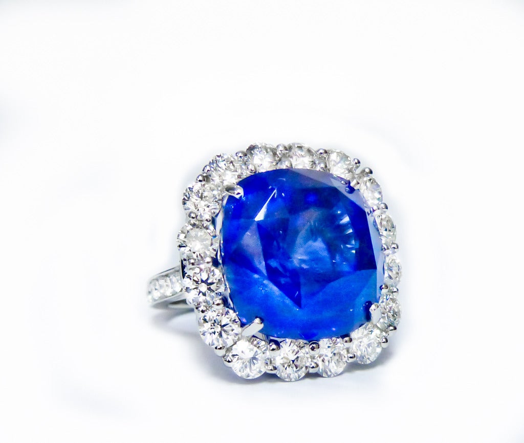 An incredible sapphire and diamond ring, originated in Ceylon and Certified by GIA laboratory, features 37.48 Carat Ceylon Sapphire in the center and surrounded by 5.50 carats, made in white gold. 
The ring is designer and hand crafted in New York.