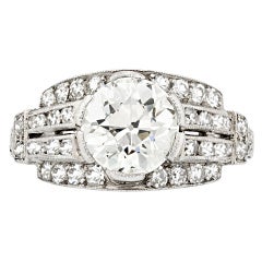 Art Deco Diamond Ring Framed by Rows of Bead-Set Diamonds