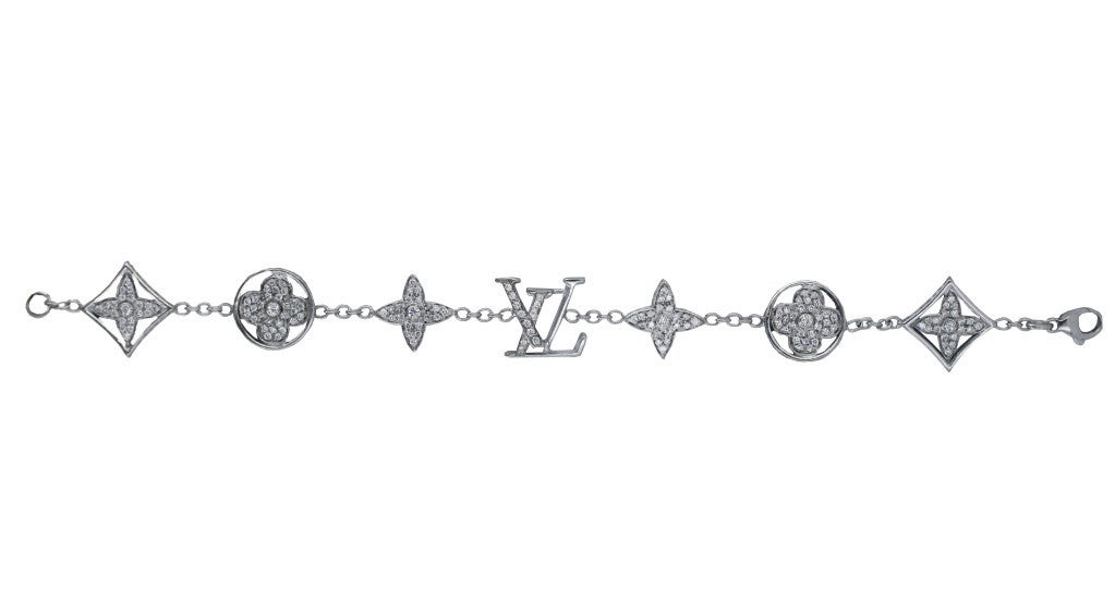 This fabulous bracelet is composed of seven individual Louis Vuitton logos that are diamond set on all three sides, and connected to one another by delicate 18K white gold links.