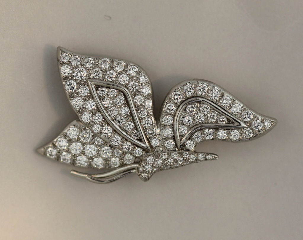 Approximately 2.85 carats of brilliant round cut diamonds of varying sizes are set into a platinum butterfly brooch designed by Tiffany & Co. in the 1990’s. Platinum antennae and shapely wing accents make this a particularly graceful piece.