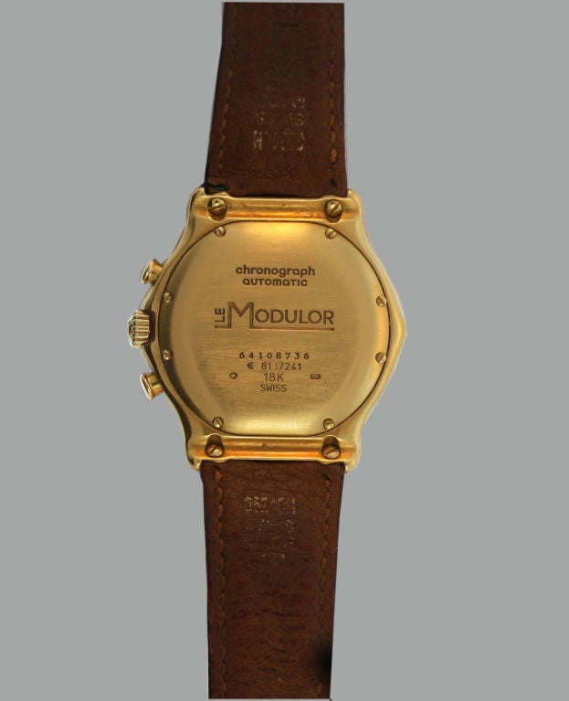 This 1990’s Ebel Swiss-made Le Modulor automatic Chronograph wristwatch of 18K yellow gold features a deployment buckle and hour, minute and second hands, in addition to the date. It measures 35mm diameter at the bezel and 40mm at the crown.