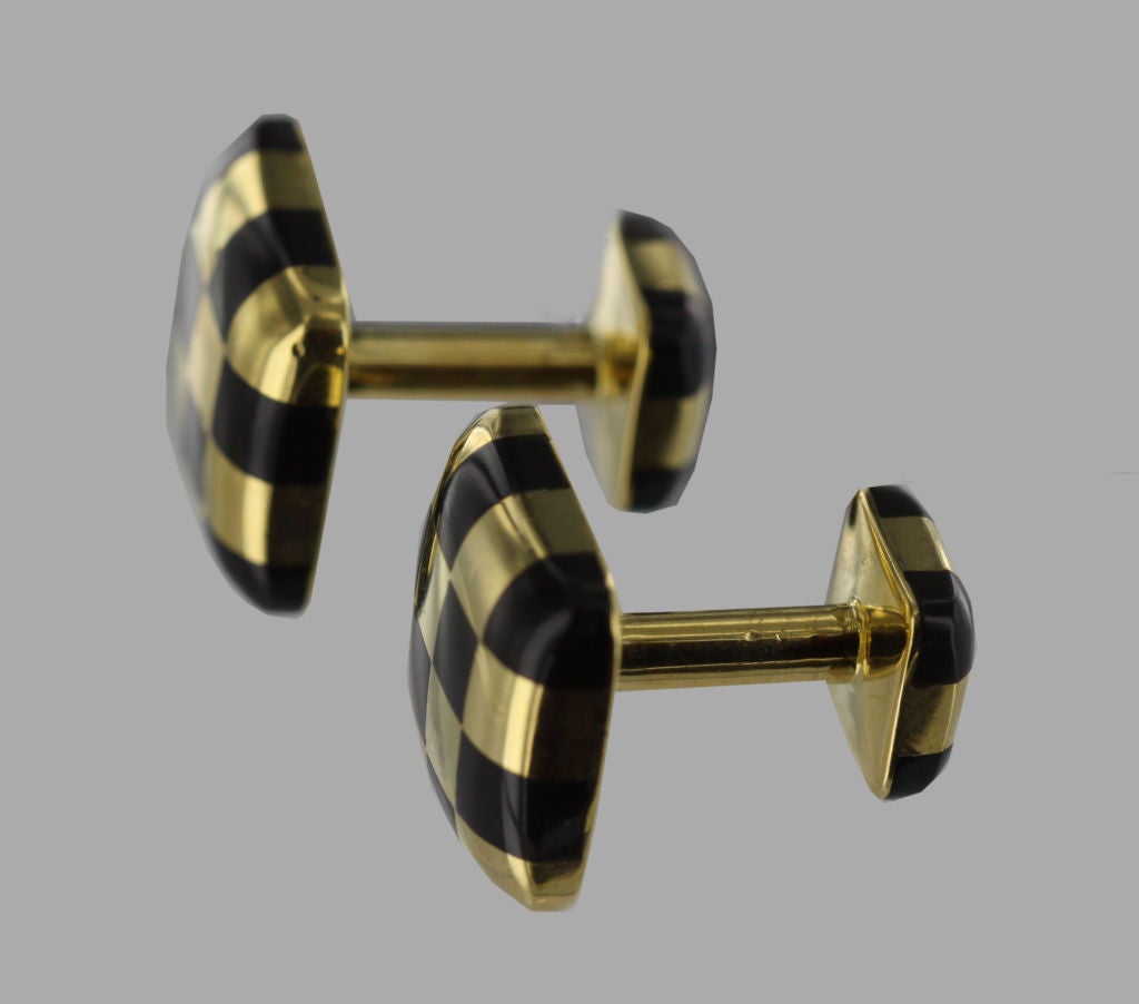 The 1980’s, Angela Cummings-designed stud set includes a pair of 18K yellow gold and black onyx cufflinks and 3 matching studs, all featuring a distinctive checkerboard pattern.