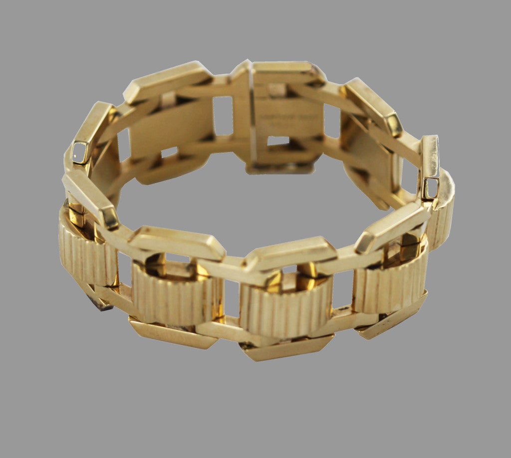 Fabulous forties 14K gold link bracelet by Cartier, with center curvilinear motifs. Numbered 9933.