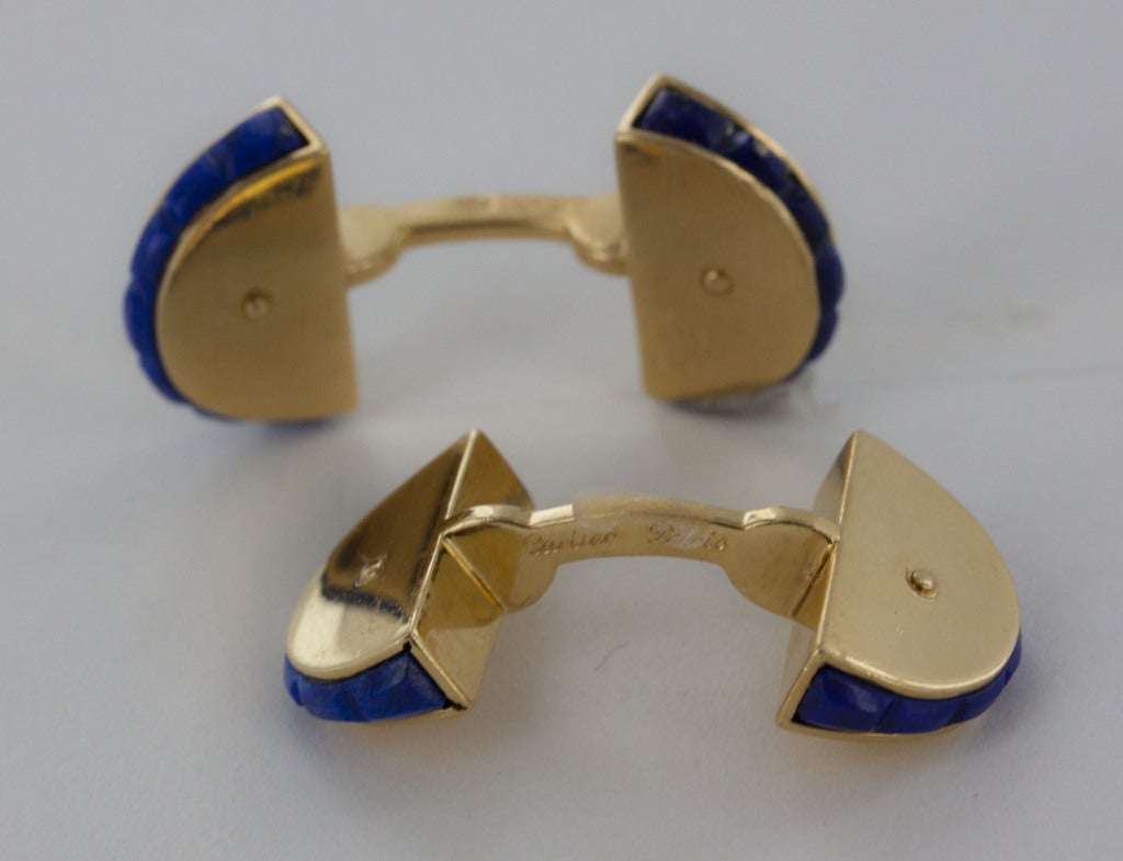 From Cartier, rare cufflinks of rich ultramarine-blue, cut-in lapis lazuli stone paired with brilliant 18K yellow gold.