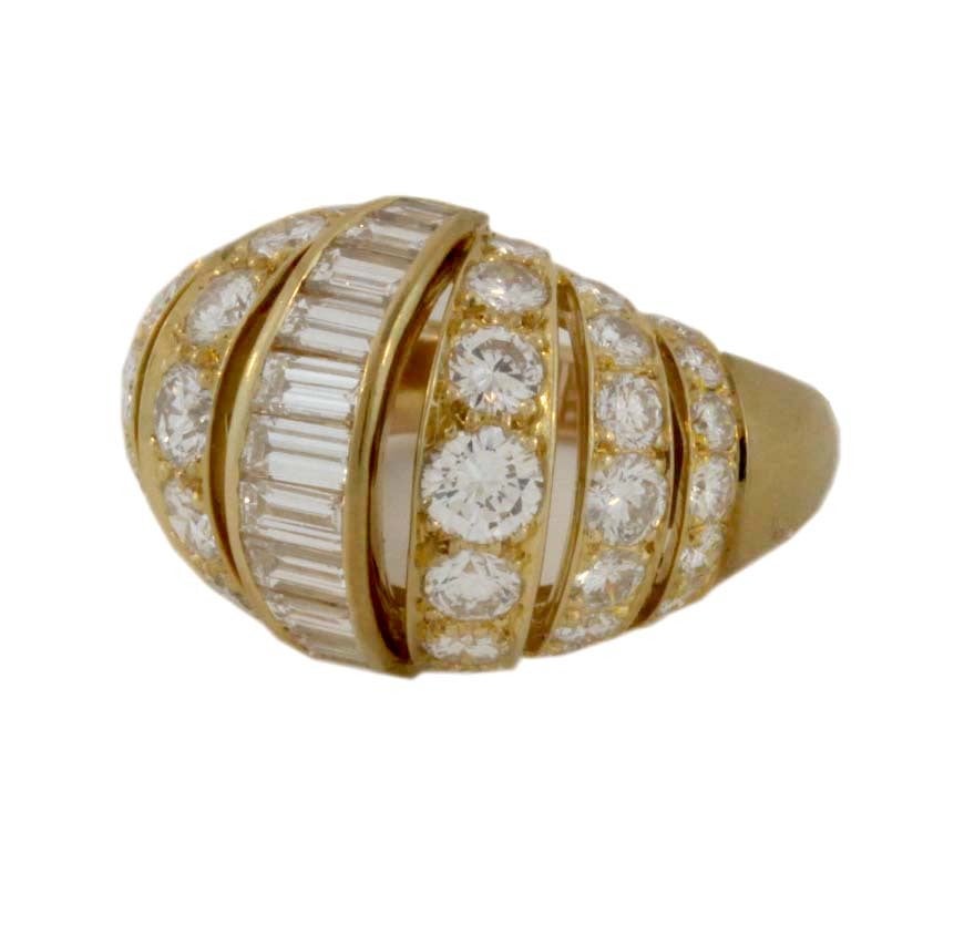 Elegant 'Turban' diamond set gold ring by Cartier Paris. Six rows of graduated round diamonds centered by one row of graduating baguette cut diamonds . A Cartier Classic bombe gem set ring referred to by Cartier Paris as 'a la Turban'.
