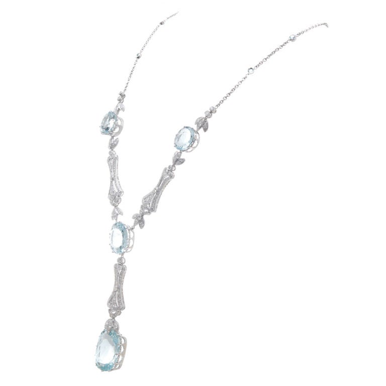 Show Stopping Aquamarine & Diamond 18K White Gold Necklace featuring a dramatic 20 Carat Aquamarine Drop at the bottom of the necklace.   An eight carat Aquamarine is followed by two additional aquamarines totaling 12 carats for a grand total of 40