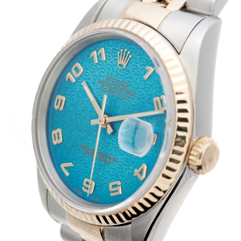 A very unique steel and 18k yellow gold Datejust. It boasts a rare dial, this jubilee style electric-blue dial. This type of color is rarely seen in all-original Rolex watches, it is very fun and not as understated as most Rolex. The other vintage