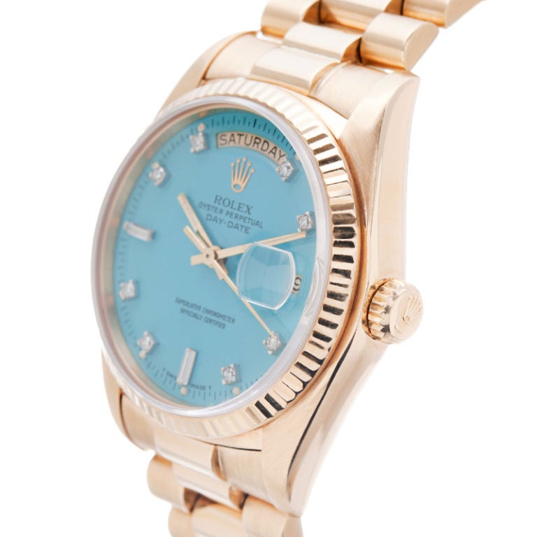 Extremely rare Stella diamond dial in turquoise, the most desirable of all colors. The dial condition is mint with antique patina day and date in a very late model Stella (one of last Stella diamond dial watches ever made). The case is also in