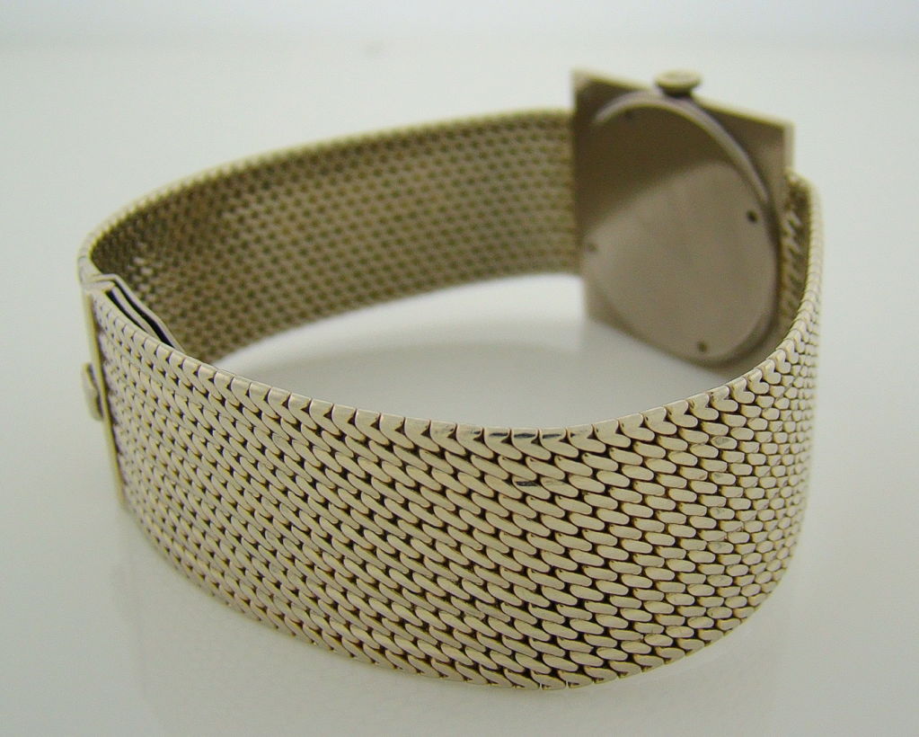 A beautiful white gold square cased and super thin vintage Rolex with an extremely rare factory original integrated white gold bracelet. Made in 1950, this wristwatch boasts the same wonderful craftsmanship all Rolex collectors are accustomed to