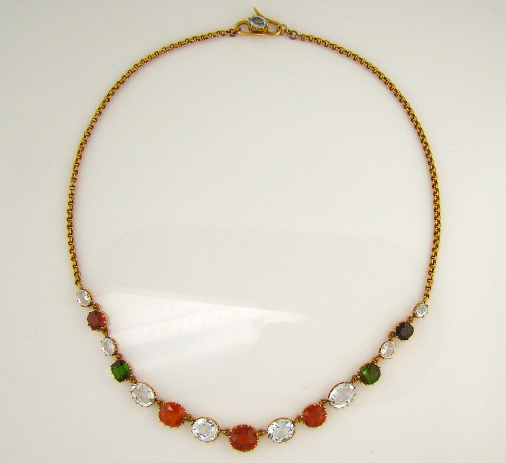 A very pretty Multi-Gem necklace handmade with a pleasing array of colored gemstones, ordered as follows from right to left:<br />
Right to Left Gem Identification: Aquamarine, Rhodolite Garnet, Aquamarine, Green Tourmaline, Aquamarine, Spessartite